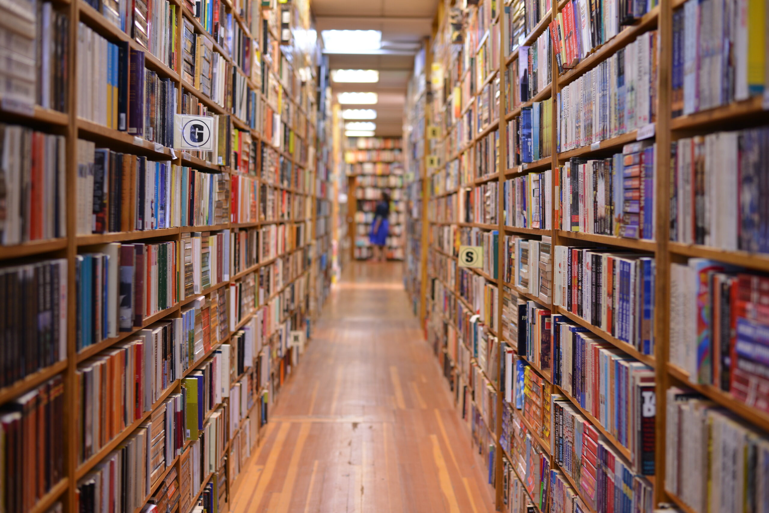 aisle between brightly colored bookshelves